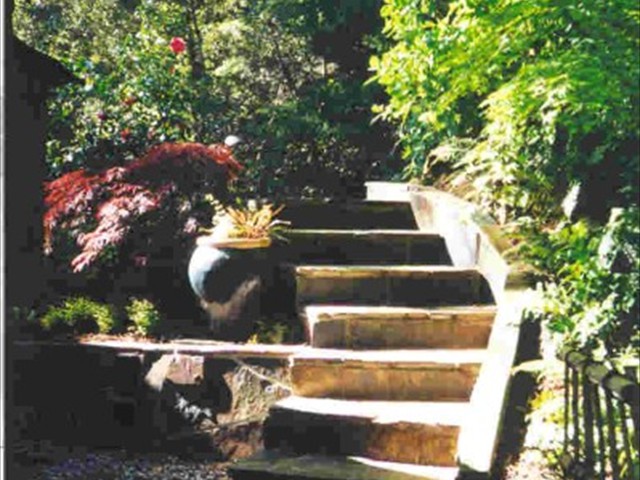 125 80 lb. bags of concrete in the stairway and retaining wall to left. Then it was all covered in Mariposa slate.   Kings Mountain2