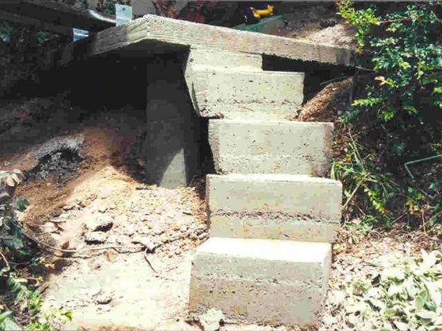 125 80 lb. bags of concrete in the stairway and retaining wall to left. Then it was all covered in Mariposa slate.   Kings Mountain3