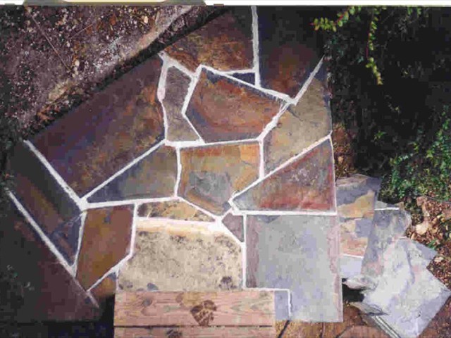 125  80 lb. bags of concrete in the stairway and retaining wall to left. Then it was all covered in Mariposa slate.   Kings Mountain4